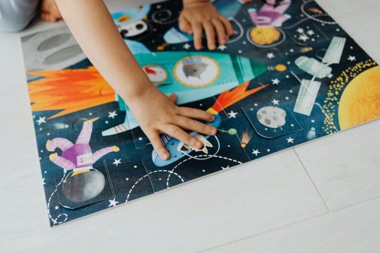 A child engages with a hands-on space-themed puzzle, fostering creativity and problem-solving skills.