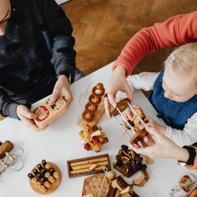 Family engaging in educational play with wooden puzzles. Perfect for learning and bonding.